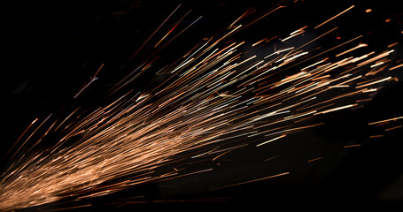 Stream of sparks on a black background