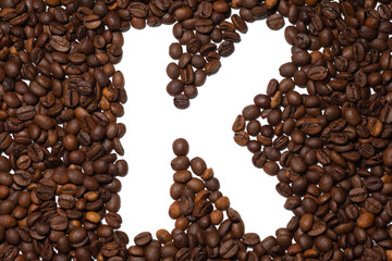 Symbol K, the letter of an aphovite made of coffee. Coffee background, letter K
