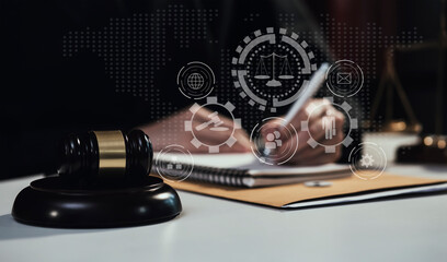 Concepts of Law and Legal services.	Lawyer business hands working with law interface icons at table...