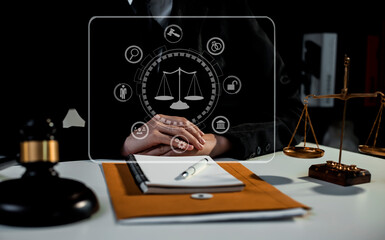 Concepts of Law and Legal services.	Lawyer business hands working with law interface icons at table office. technology and lawyer. 