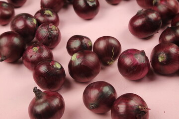 sweet red onions on background