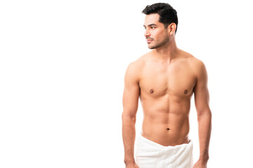 Shirtless Hispanic male in towel