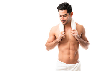 Fototapeta premium Attractive latin man after bath in towel