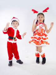 Merry Christmas girl Wearing Santa claus suit Dancing baby shark on white background