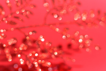 valentine's day blurred lights garland bokeh on red background, for text place. festive wedding background, bluer focus