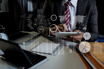 Business finance technology concept. Hands of business using digital analyzing sales data and economic growth graph chart with  digital marketing .