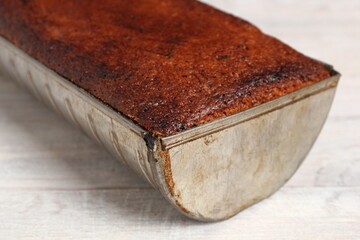 Freshly baked raisin butter cake in loaf tin