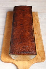 Freshly baked raisin butter cake in loaf tin