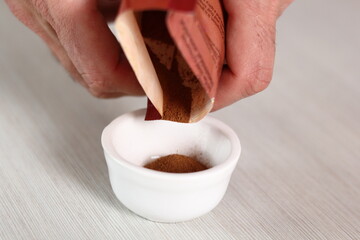Pouring Cinnamon into Bowl. Making Apple Tarte Tatin with Cinnamon Series.