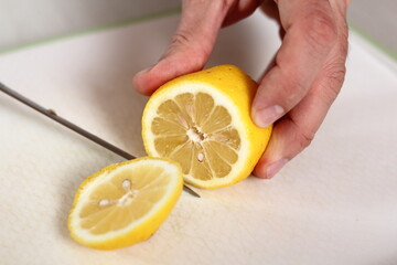 Cutting top of lemon. Making Apple Tarte Tatin with Cinnamon Series.