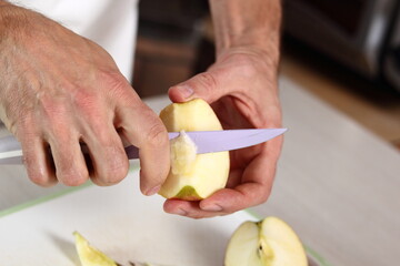 Remove cores of apples. Making Apple Tarte Tatin with Cinnamon Series.