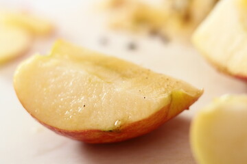 Apple quarter dipped in lemon juice. Making Apple Tarte Tatin with Cinnamon Series.