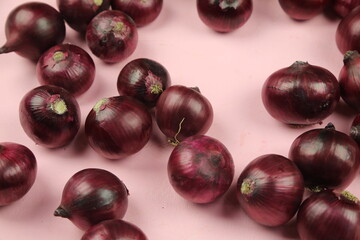 sweet red onions on background