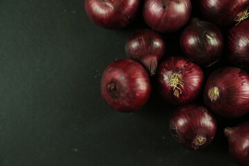sweet red onions on background