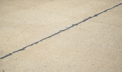 Old concrete pavement road with longitudinal joint and construction joint.Joints Sealant made by asphalt.