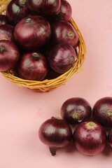 sweet red onions on background