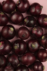 sweet red onions on background