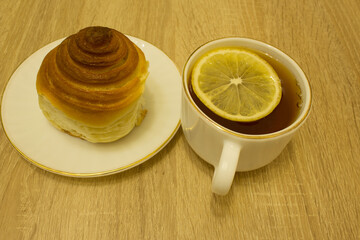 tea with lemon and bun