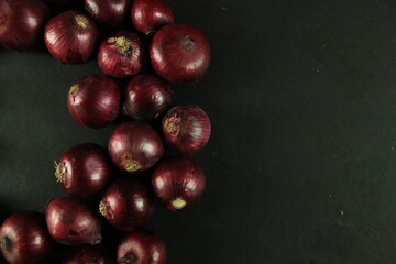 sweet red onions on background