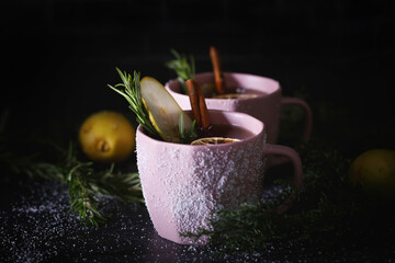 tea with pear rosemary cinnamon and lemon is on the table
