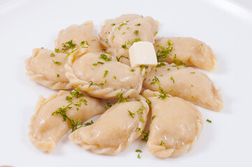 dumplings with butter on a white background