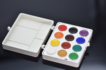 watercolor paints  isolated on a black background.