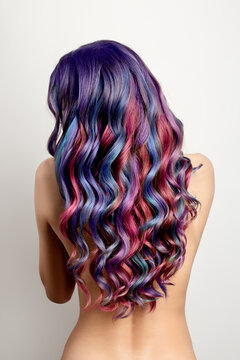 woman with thick wavy hair and a variety of shades of color palette. Coloring in different colors. Ombre