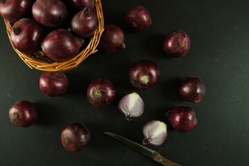sweet red onions on background