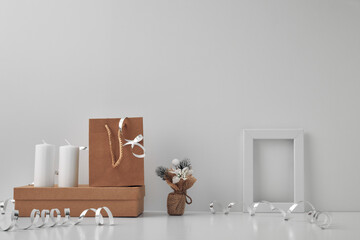 Frame, white candles and New Year's decor on a white background. Copy space, mock up