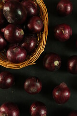 sweet red onions on background
