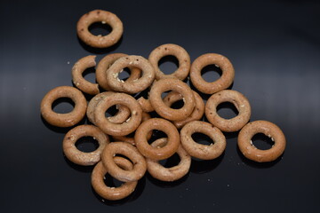 Pretzels crackers bagels  with wine,crispy goodies with lemon and pepper