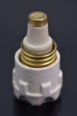 Old white ceramic electric fuse. Electrical surge protection