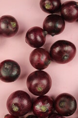 sweet red onions on background