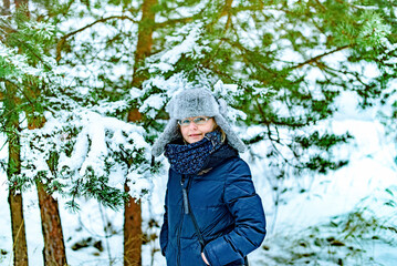 Christmas woman. Portrait of woman in winter outdoors in a winter cap