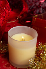 christmas aroma candle around  red decorations. Christmas holiday concept