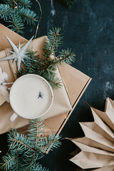 Winter composition with boxes of gifts and cappuccino. Scandinavian style, top view