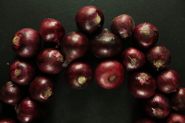sweet red onions on background