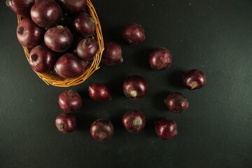 sweet red onions on background