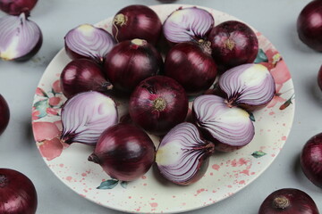 sweet red onions on background
