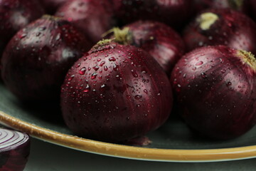 sweet red onions on background