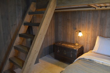 Obraz na płótnie Canvas Detail of a rustic cabin's bedroom