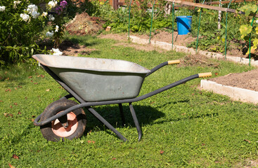 empty wheelbarrow in the garden