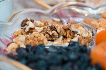 walnuts on a plate with different sweets