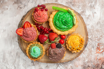 top view delicious cream cakes with fruits on white background sweet dessert cakes biscuit