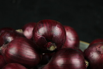 sweet red onions on background