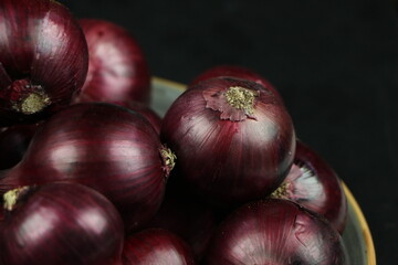 sweet red onions on background