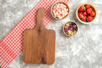 top view fresh strawberries with candies on the white background candy sweet fruit