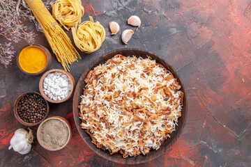 top view cooked rice along with seasonings on dark floor food dish photo meal