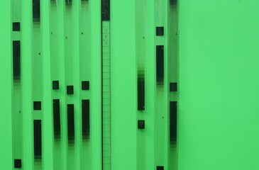 A film strip tested hang on a green wall to referrence.