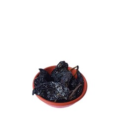 Dried ancho chili peppers in a bowl on white background, typical Mexican food. Healthy food concept